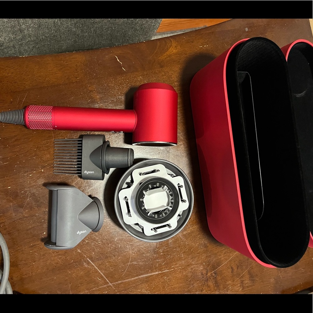 Limited edition red supersonic dyson hair dryer.